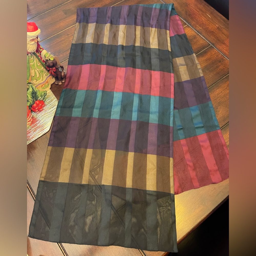 Scarf with rich maroons,teals,and browns.